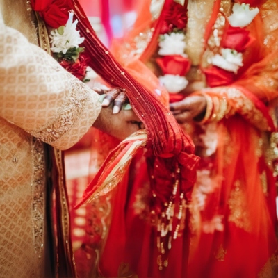 Close-up of hands during an Indian wedding ceremony